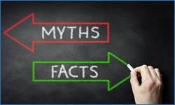 Businessman drawing Myths or Facts on blackboard