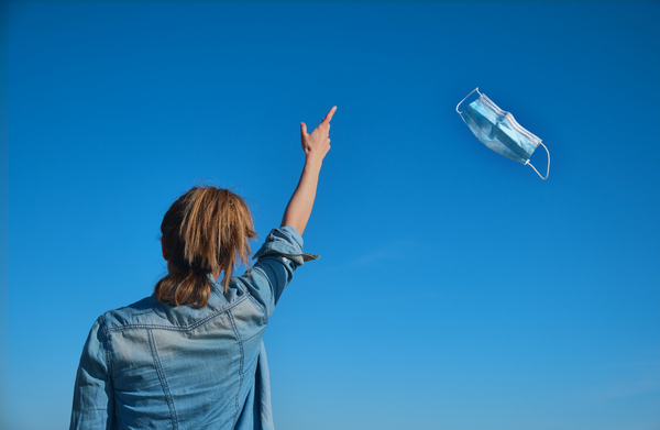 Happy,And,Liberated,Woman,Throwing,Her,Mask,In,The,Air