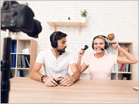 Man,And,Woman,Podcasters,In,White,Shirts,Play,Video,Games